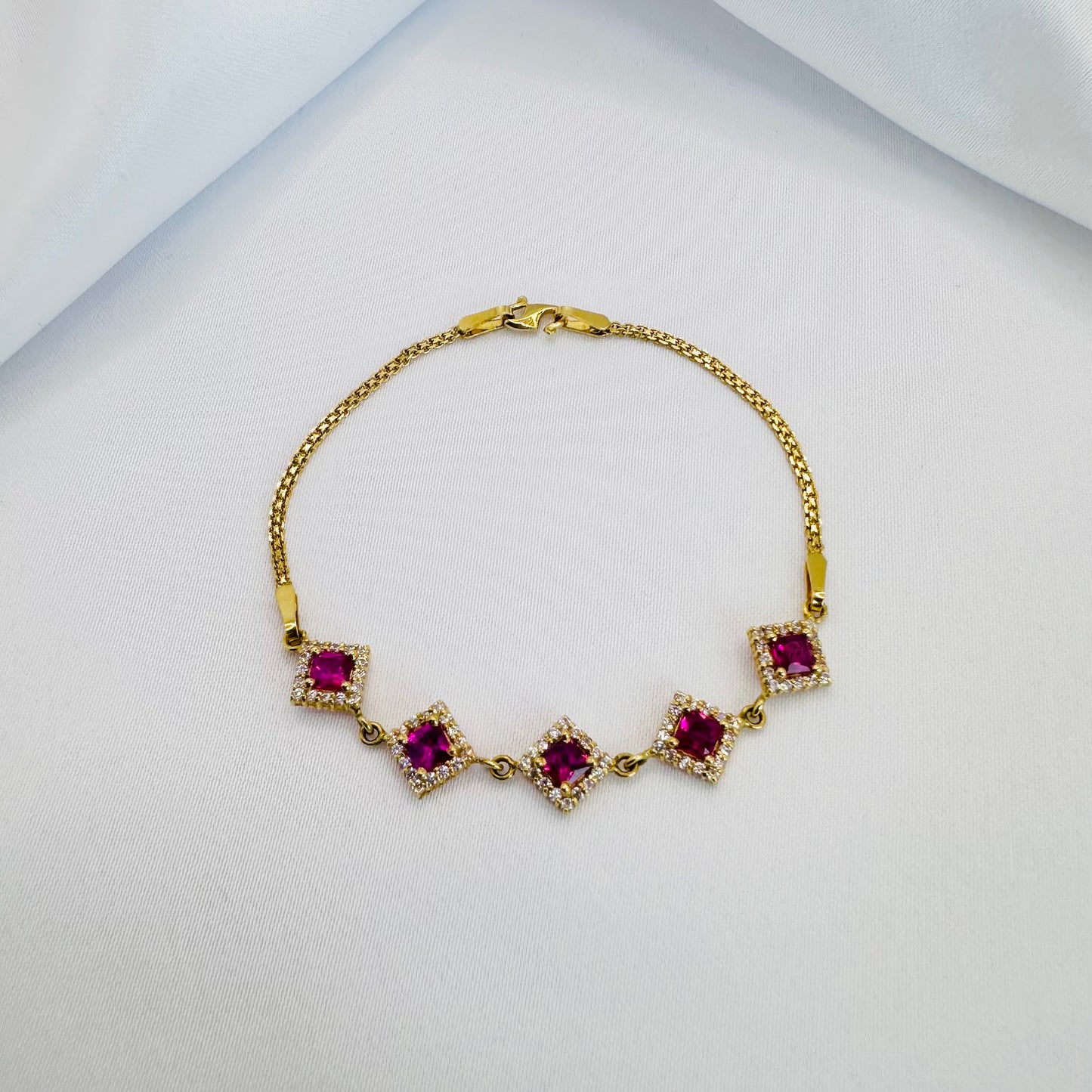 22k solid gold designer bracelet with white and ruby colour CZ