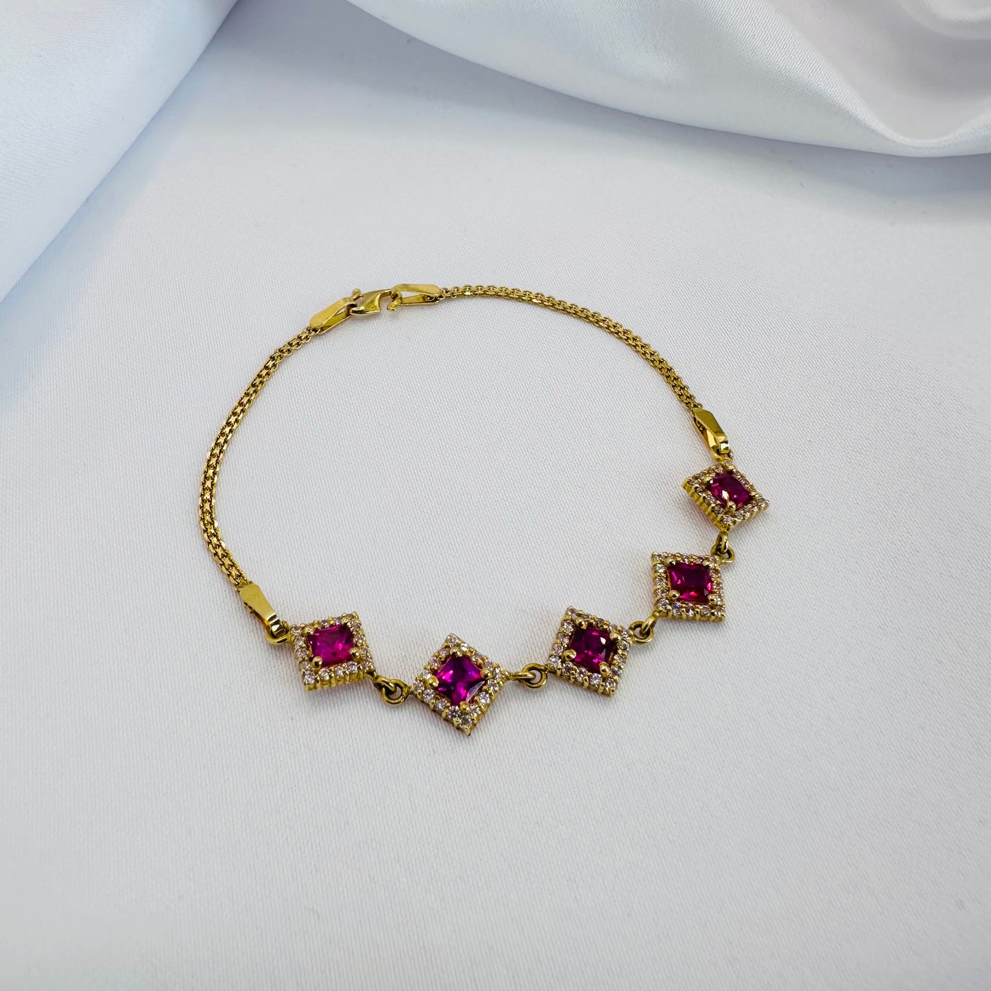 22k solid gold designer bracelet with white and ruby colour CZ